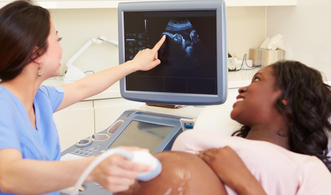 Pregnant black woman having a scan